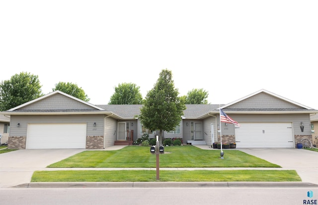 6707 S Witzke Ave, Sioux Falls, SD 57108 - ranch-style house with driveway, a garage, and a front lawn