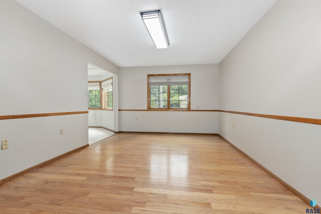 4220 S Minnesota Ave Unit 206, Sioux Falls, SD 57105 - empty room featuring light wood-style floors and baseboards