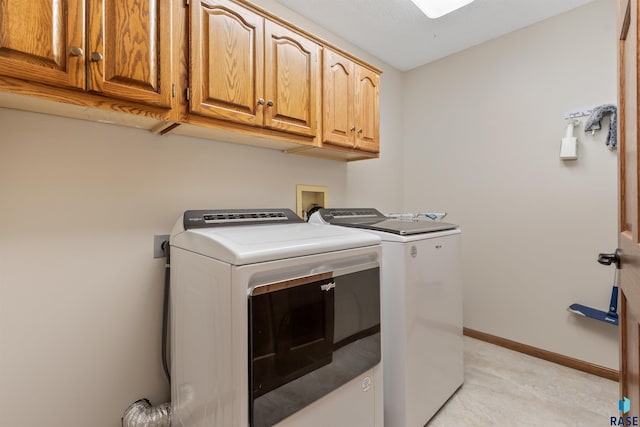4220 S Minnesota Ave Unit 206, Sioux Falls, SD 57105 - laundry room featuring cabinet space and washing machine and clothes dryer