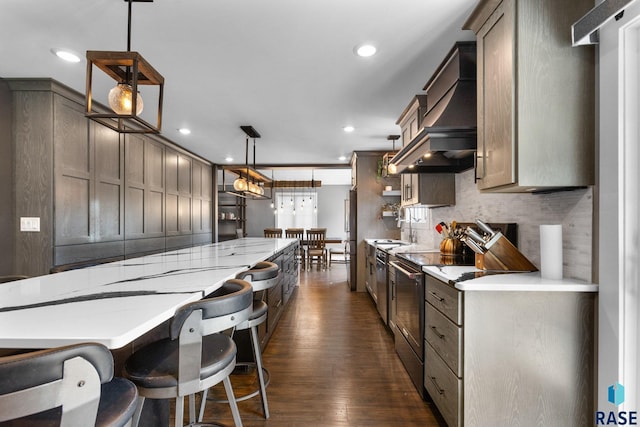 4513 S Southridge Dr, Sioux Falls, SD 57105 - kitchen with range with electric stovetop, dark wood-type flooring, tasteful backsplash, recessed lighting, and premium range hood