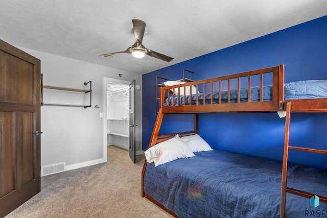 4513 S Southridge Dr, Sioux Falls, SD 57105 - bedroom with carpet flooring, ceiling fan, and a walk in closet