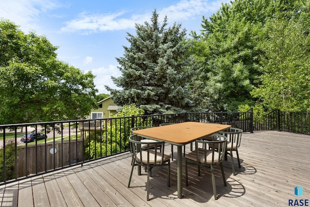 4513 S Southridge Dr, Sioux Falls, SD 57105 - wooden deck featuring outdoor dining area