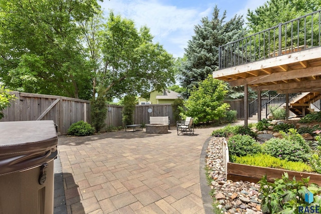 4513 S Southridge Dr, Sioux Falls, SD 57105 - fenced backyard with an outdoor fire pit, a patio area, stairs, and a wooden deck