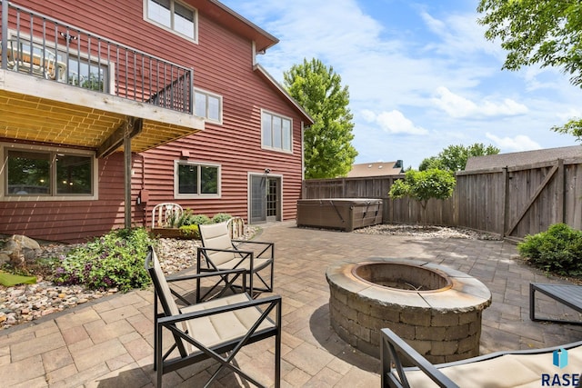 4513 S Southridge Dr, Sioux Falls, SD 57105 - patio / terrace with a hot tub, an outdoor fire pit, a patio, and a fenced backyard