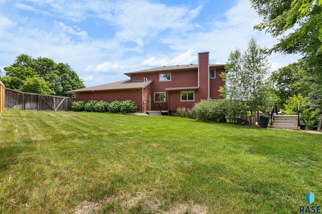 4513 S Southridge Dr, Sioux Falls, SD 57105 - back of house with a chimney