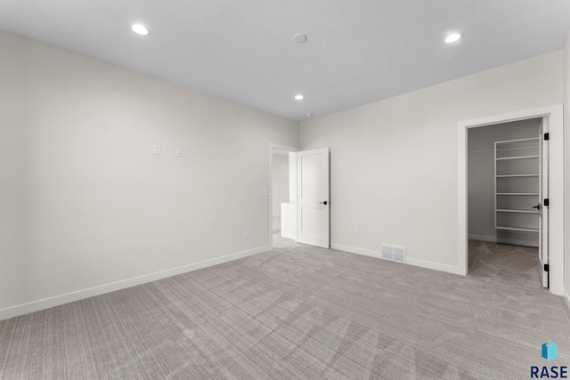 106 N Bryggen Pl, Sioux Falls, SD 57107 - spare room featuring light carpet and recessed lighting