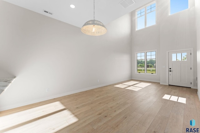 106 N Bryggen Pl, Sioux Falls, SD 57107 - entryway with a towering ceiling, plenty of natural light, light wood-style flooring, and recessed lighting