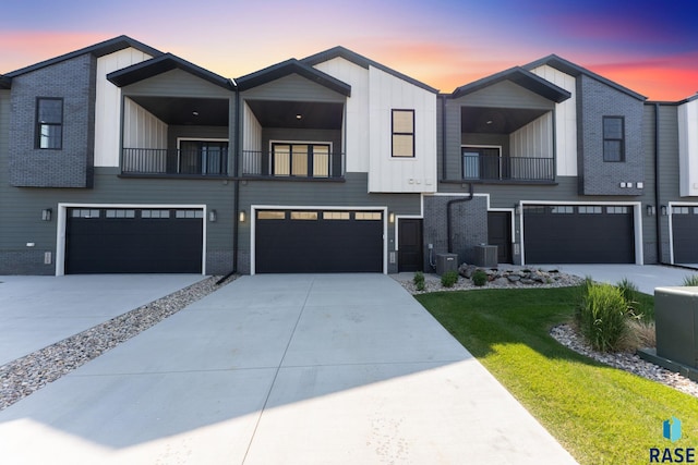 106 N Bryggen Pl, Sioux Falls, SD 57107 - townhome / multi-family property featuring a balcony, a garage, and board and batten siding
