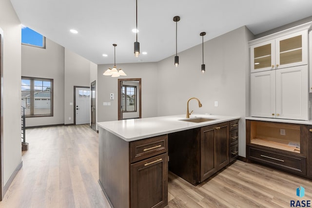 8619 W Shoreline Pl, Sioux Falls, SD 57107 - kitchen featuring a peninsula, healthy amount of natural light, light wood finished floors, and recessed lighting