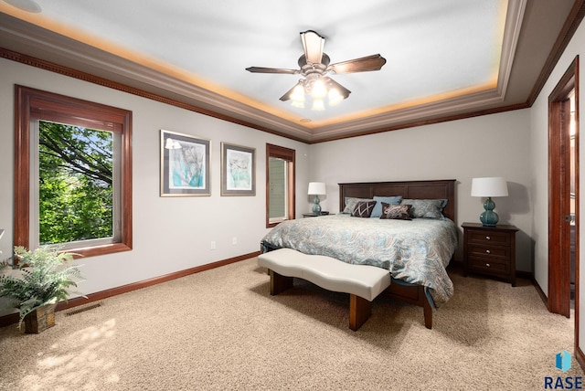 4400 E Aster Cir, Sioux Falls, SD 57103 - carpeted bedroom with ornamental molding, a raised ceiling, and a ceiling fan