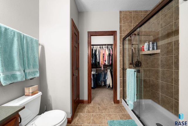 4400 E Aster Cir, Sioux Falls, SD 57103 - full bathroom featuring a stall shower, vanity, tile patterned flooring, and a spacious closet