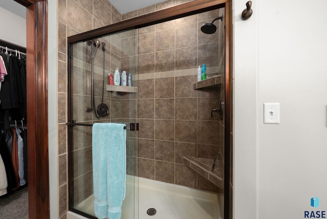 4400 E Aster Cir, Sioux Falls, SD 57103 - bathroom with a walk in closet and a stall shower