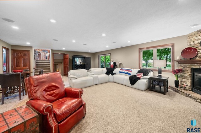 4400 E Aster Cir, Sioux Falls, SD 57103 - carpeted living area featuring stairway, a fireplace, and recessed lighting