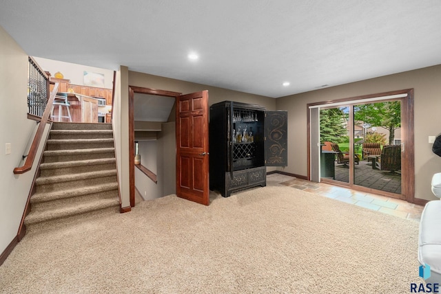 4400 E Aster Cir, Sioux Falls, SD 57103 - living room featuring stairway, recessed lighting, a dry bar, and light carpet