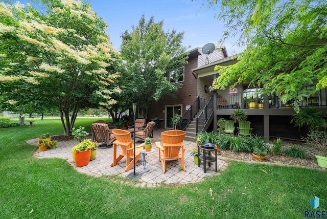 4400 E Aster Cir, Sioux Falls, SD 57103 - view of grassy yard featuring stairway, a patio area, and a deck