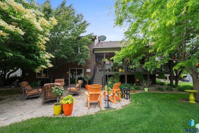4400 E Aster Cir, Sioux Falls, SD 57103 - view of grassy yard featuring stairs, a patio, and a deck