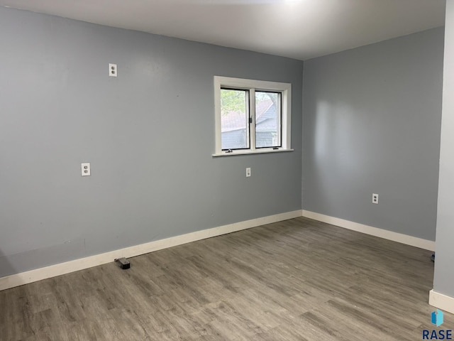 651 N 5th Ave, Canistota, SD 57012 - unfurnished room featuring wood finished floors