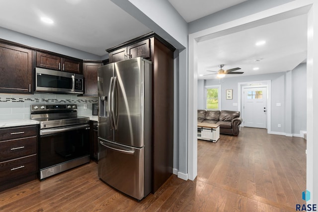 600 Sunnyside Ave, Valley Springs, SD 57068 - kitchen with appliances with stainless steel finishes, dark brown cabinetry, light countertops, dark wood-style floors, and recessed lighting