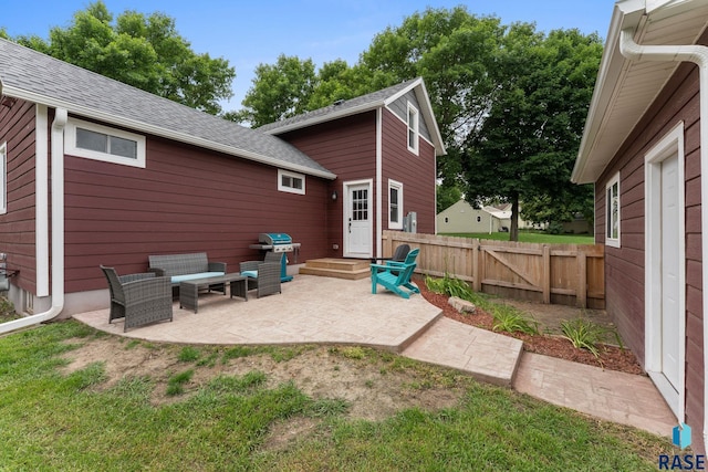 600 Sunnyside Ave, Valley Springs, SD 57068 - rear view of property with a patio, an outdoor living space, and a shingled roof