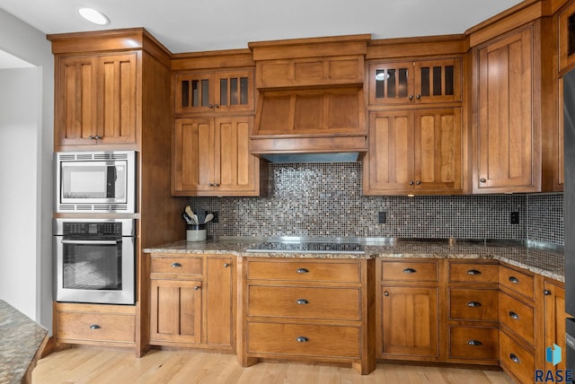 9005 E Torrey Pine Cir, Sioux Falls, SD 57110 - kitchen with stainless steel appliances and brown cabinetry