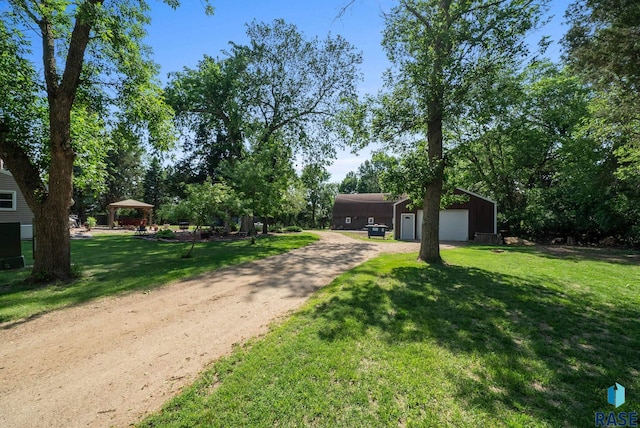 26045 485th Ave, Valley Springs, SD 57068 - view of grassy yard with dirt driveway, an outbuilding, and a gazebo