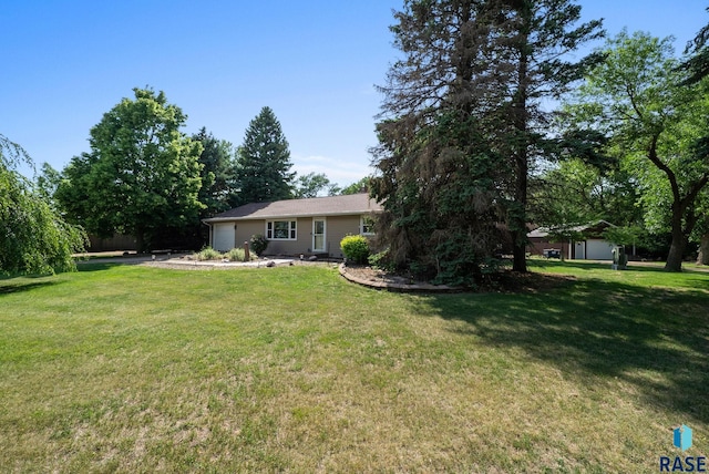26045 485th Ave, Valley Springs, SD 57068 - view of grassy yard featuring a garage