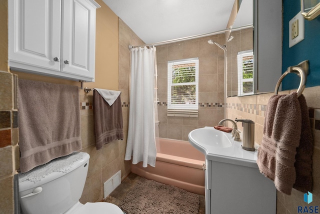 26045 485th Ave, Valley Springs, SD 57068 - bathroom with tile walls, vanity, and shower / tub combo with curtain