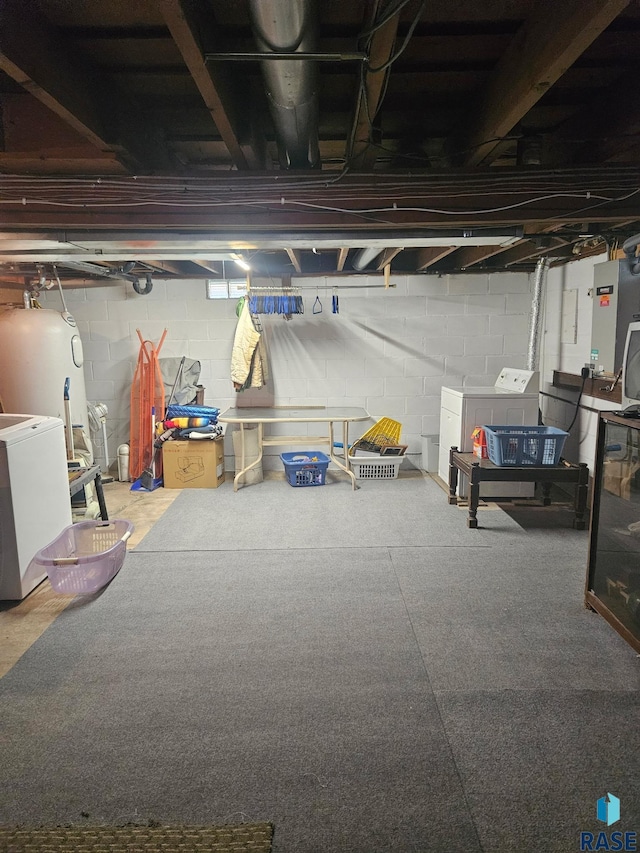 26045 485th Ave, Valley Springs, SD 57068 - unfinished basement featuring washer and dryer, concrete block wall, and water heater