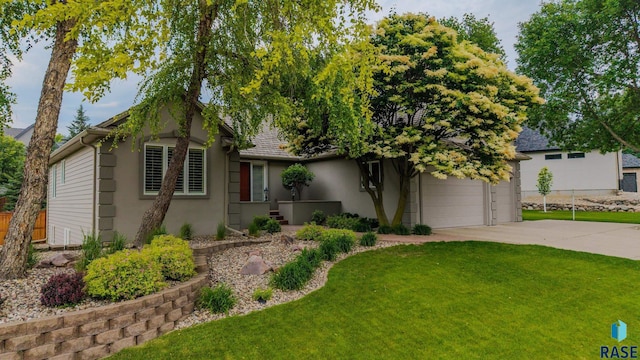18 S Elkjer Cir, Sioux Falls, SD 57103 - view of front of home with concrete driveway, stucco siding, and a garage
