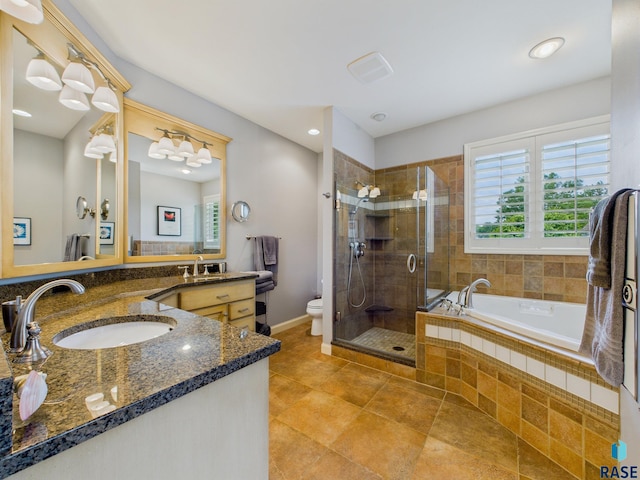 18 S Elkjer Cir, Sioux Falls, SD 57103 - bathroom with plenty of natural light, vanity, a shower stall, a bath, and recessed lighting