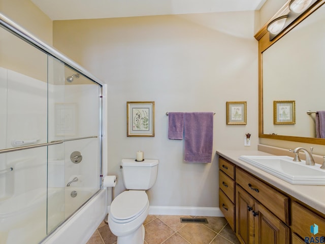 18 S Elkjer Cir, Sioux Falls, SD 57103 - bathroom with vanity, tile patterned floors, and enclosed tub / shower combo