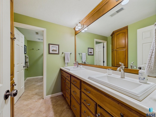 18 S Elkjer Cir, Sioux Falls, SD 57103 - full bathroom featuring double vanity and tile patterned flooring
