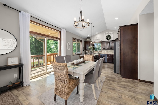 212 N Fairway Dr, Brandon, SD 57005 - dining room with a chandelier, vaulted ceiling, light wood-style floors, and recessed lighting