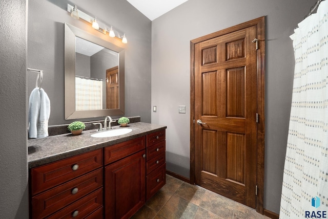 212 N Fairway Dr, Brandon, SD 57005 - full bathroom with vanity, a shower with shower curtain, and stone finish flooring