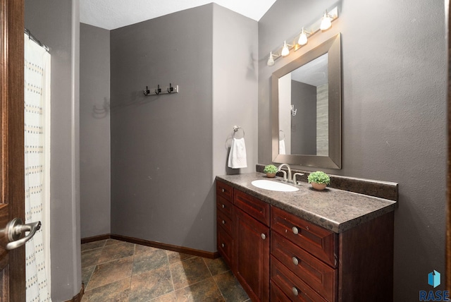 212 N Fairway Dr, Brandon, SD 57005 - bathroom with vanity and stone finish floors