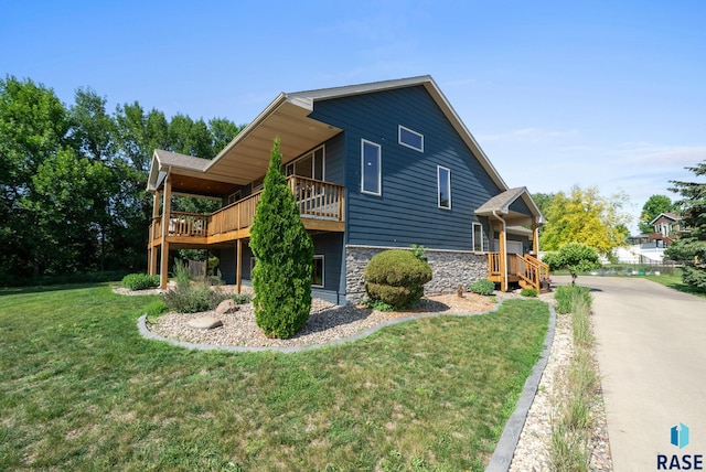 212 N Fairway Dr, Brandon, SD 57005 - view of property exterior with stone siding, a yard, and a wooden deck