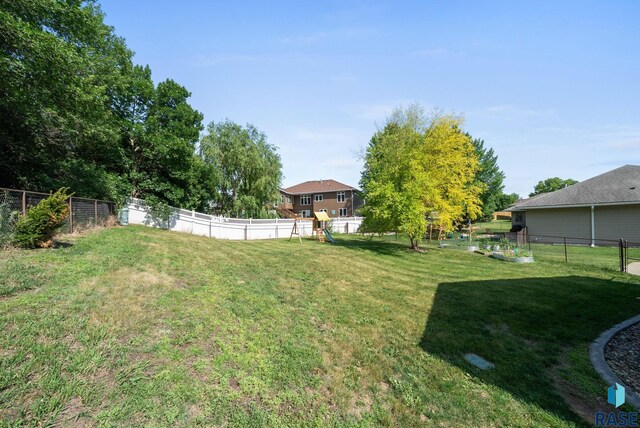 212 N Fairway Dr, Brandon, SD 57005 - fenced backyard with a playground