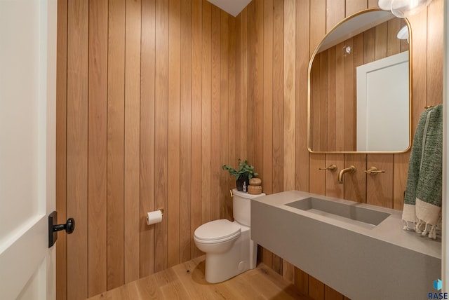 1617 S Scarlet Oak Pl, Sioux Falls, SD 57110 - bathroom featuring toilet and wooden walls
