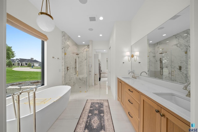 1617 S Scarlet Oak Pl, Sioux Falls, SD 57110 - full bath with a marble finish shower, a freestanding bath, double vanity, and recessed lighting