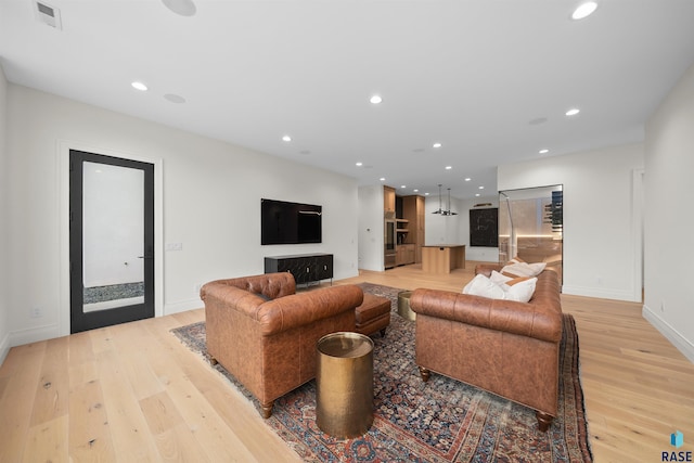 1617 S Scarlet Oak Pl, Sioux Falls, SD 57110 - living area featuring light wood finished floors and recessed lighting