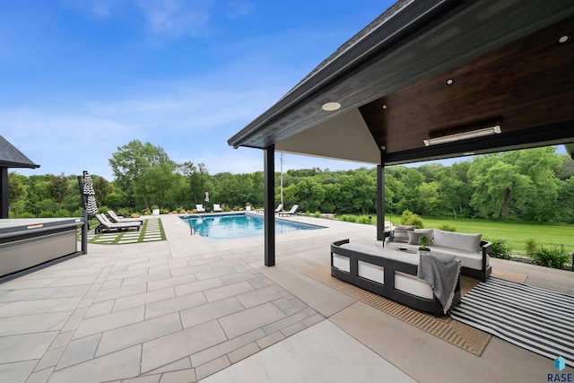 1617 S Scarlet Oak Pl, Sioux Falls, SD 57110 - outdoor pool featuring a patio area, an outdoor hangout area, and view of wooded area