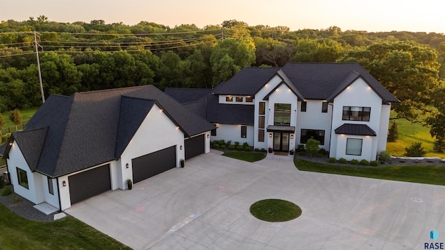 1617 S Scarlet Oak Pl, Sioux Falls, SD 57110 - modern inspired farmhouse with an attached garage, driveway, and stucco siding