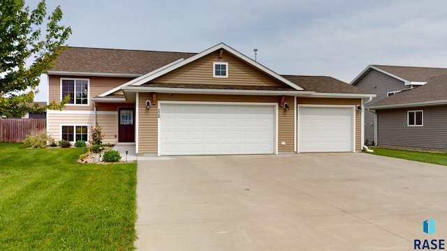 210 Lindsay Dr, Aurora, SD 57002 - view of front facade featuring concrete driveway and a garage