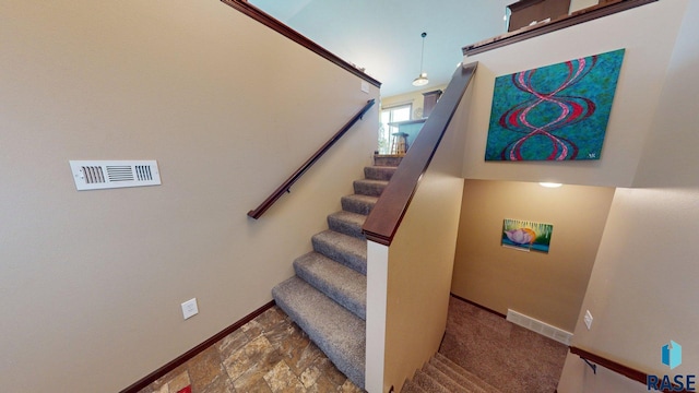 210 Lindsay Dr, Aurora, SD 57002 - stairway featuring baseboards and stone finish floors
