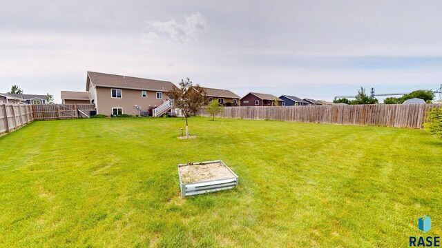 210 Lindsay Dr, Aurora, SD 57002 - fenced backyard with stairs