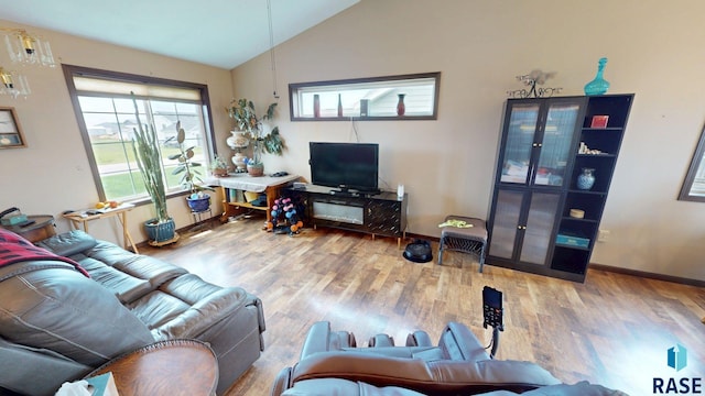 210 Lindsay Dr, Aurora, SD 57002 - living room with vaulted ceiling and wood finished floors