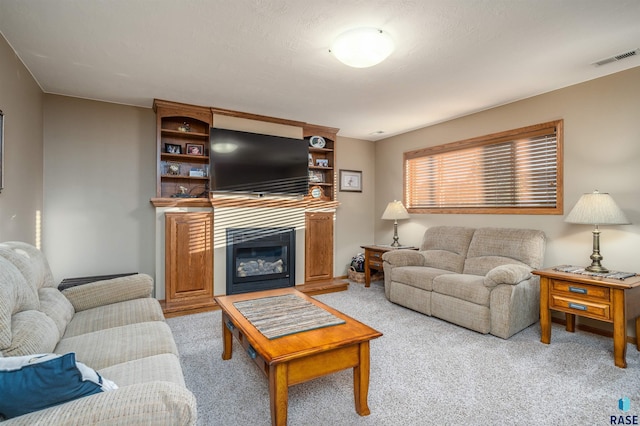 3121 S Dubuque Ave, Sioux Falls, SD 57110 - living area with light colored carpet and a glass covered fireplace