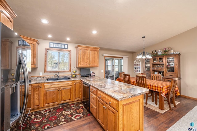 3121 S Dubuque Ave, Sioux Falls, SD 57110 - kitchen featuring freestanding refrigerator, dishwasher, a peninsula, dark wood-type flooring, and recessed lighting