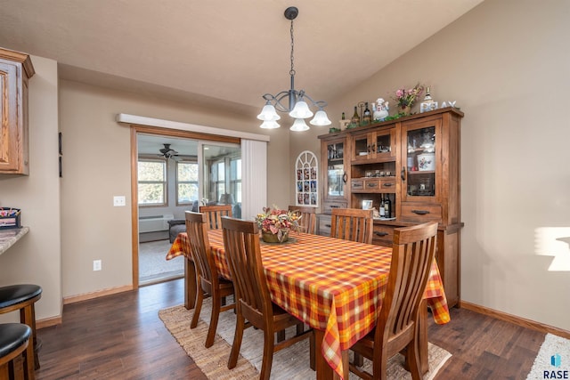 3121 S Dubuque Ave, Sioux Falls, SD 57110 - dining area featuring dark wood-style floors, a chandelier, and vaulted ceiling