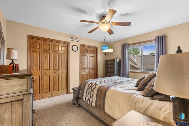3121 S Dubuque Ave, Sioux Falls, SD 57110 - carpeted bedroom featuring two closets and a ceiling fan